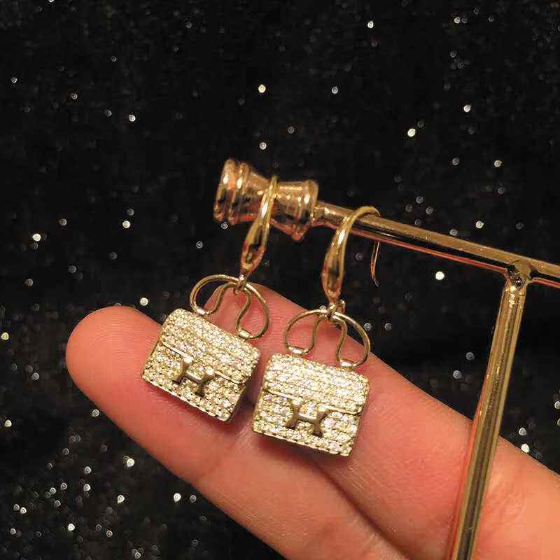 Alternative view of Hermes Amulettes Constance Earrings Gold Tone