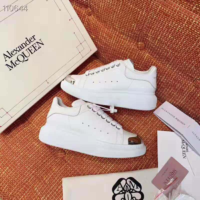 Close-up of lace-up and branded heel on Alexander McQueen Oversized Sneaker