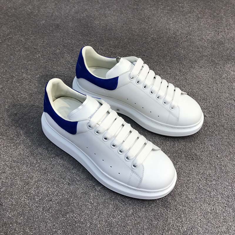 Close-up of navy blue branded heel detail on Alexander McQueen sneakers
