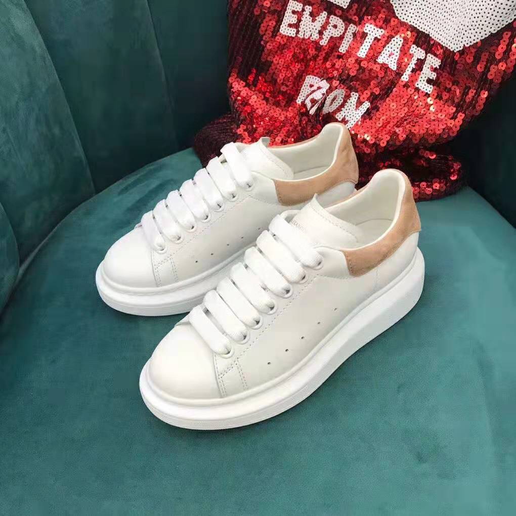 Close-up on smooth calf leather and lace-up detail of Alexander McQueen sneaker
