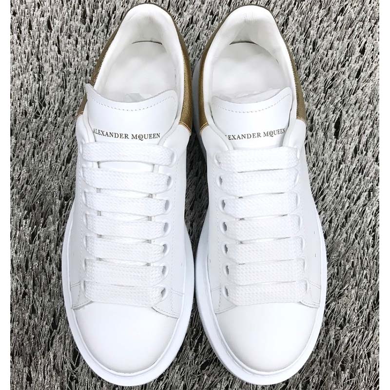 Overhead view showing white laces and chunky sole of Alexander Mcqueen Men Oversized Sneaker Shoes-Gold