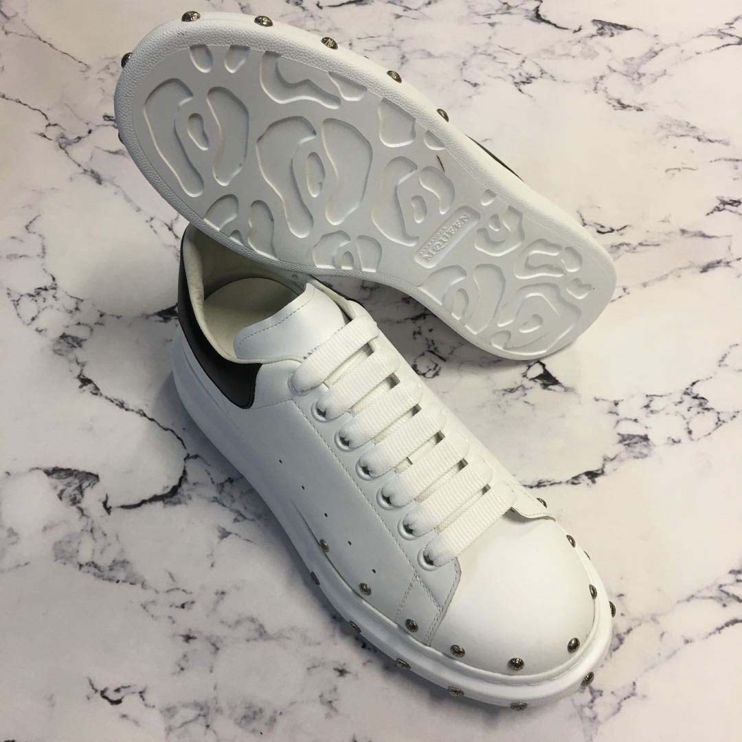 Top down view showing white leather and lace-up closure on Alexander Mcqueen Men Oversized Sneaker