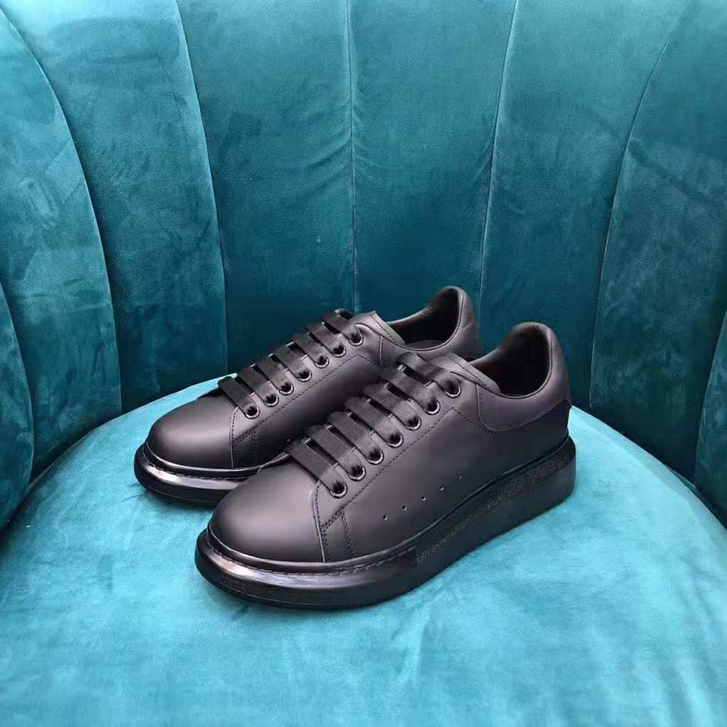 Top view showing lace-up closure on Alexander Mcqueen black oversized sneaker