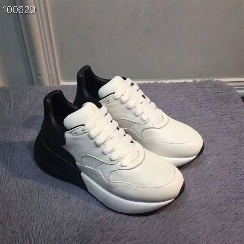 Close-up on chunky 50mm heel detail on Alexander Mcqueen Unisex Oversized Runner sneaker