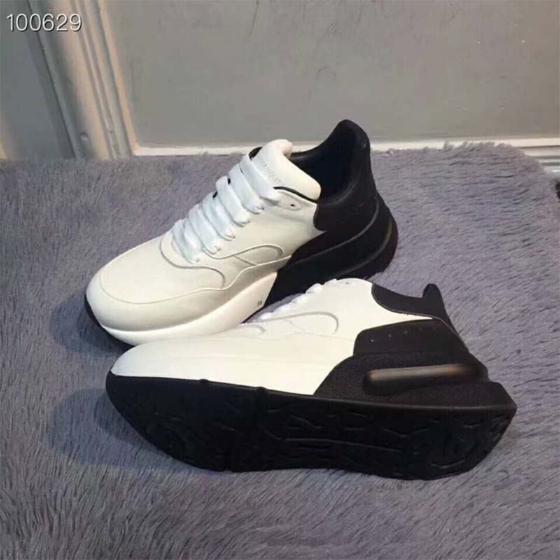 Top view showing black laces and white leather of Alexander Mcqueen Unisex Oversized Runner