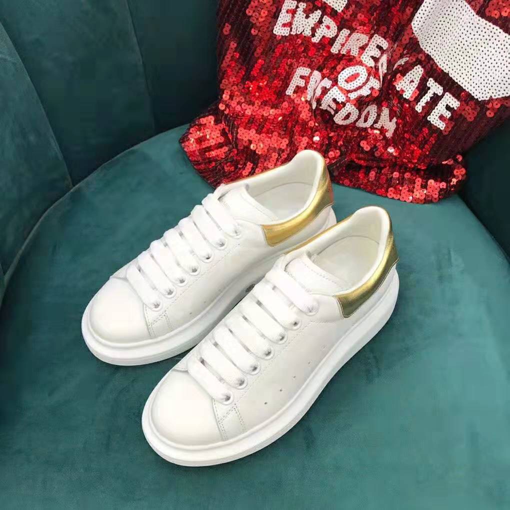 Overhead view showing lace-up closure and chunky sole of Alexander Mcqueen white sneaker