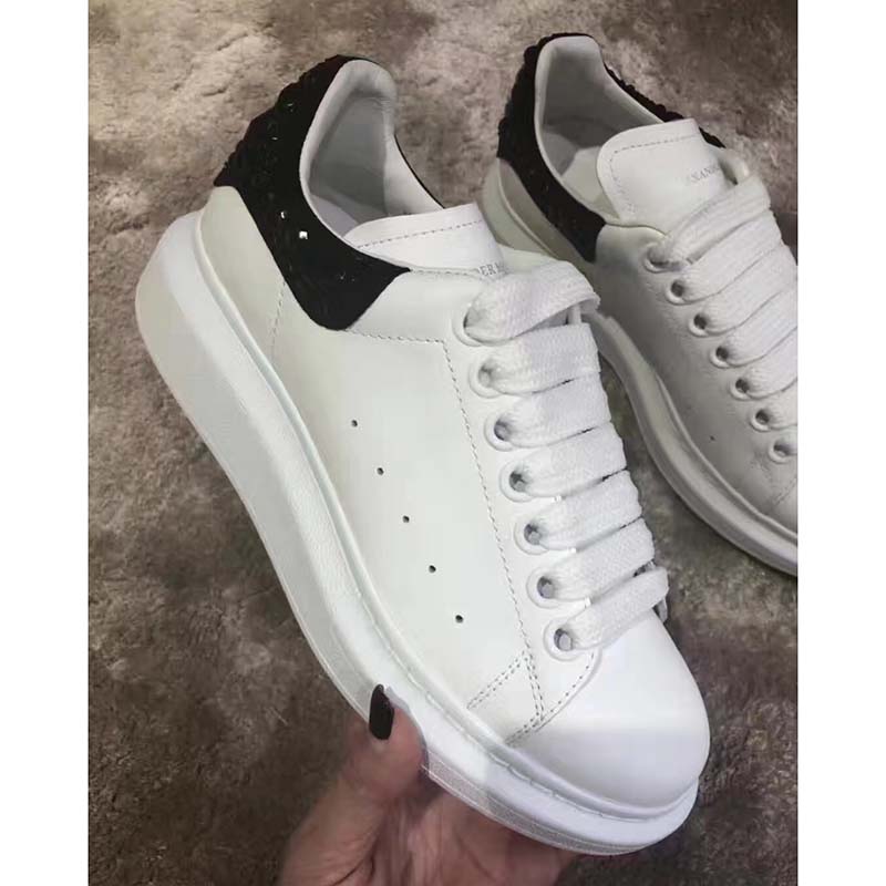 Top angle of Alexander Mcqueen Women Oversized Sneaker showing white lace-up detail