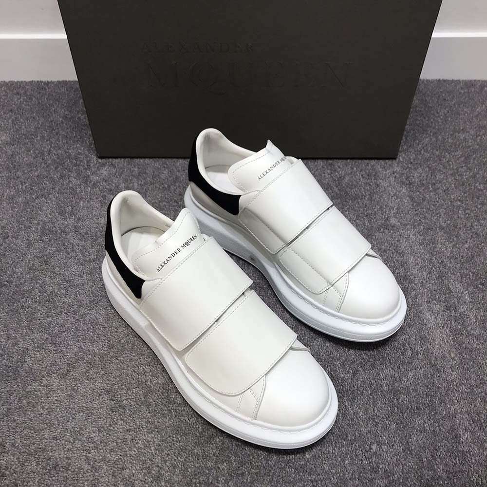 Close-up of double-strap closure and branded hardware on Alexander Mcqueen sneaker