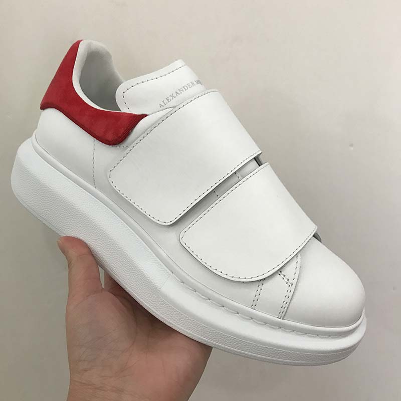 Close-up on red double-strap detail of Alexander Mcqueen Women Oversized Sneaker