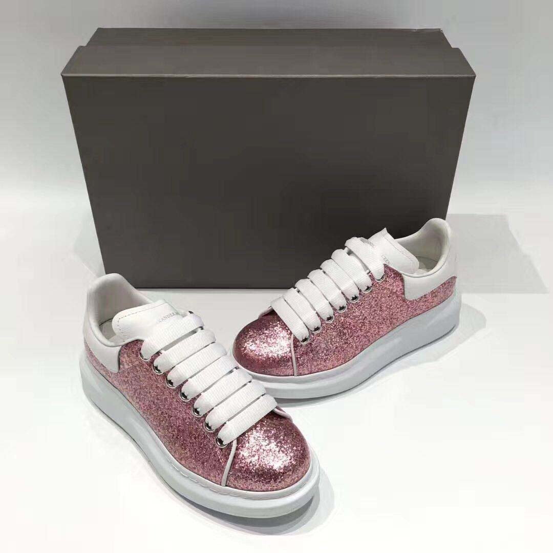Side profile showing oversized sole of Alexander Mcqueen Women Oversized Sneaker Pink