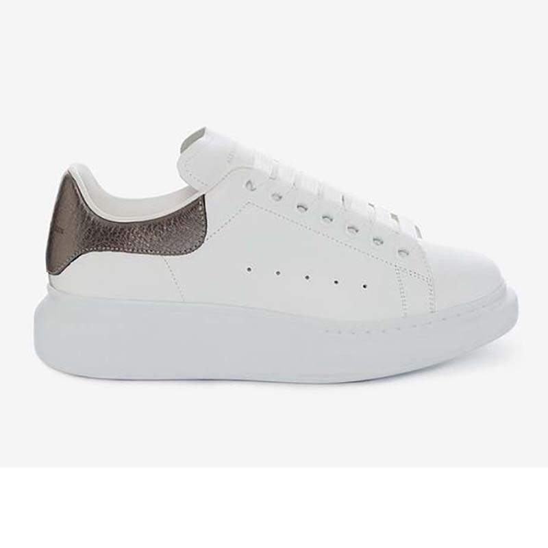 Front angle of Alexander Mcqueen Women Shoes Oversized Sneaker-Brown in white