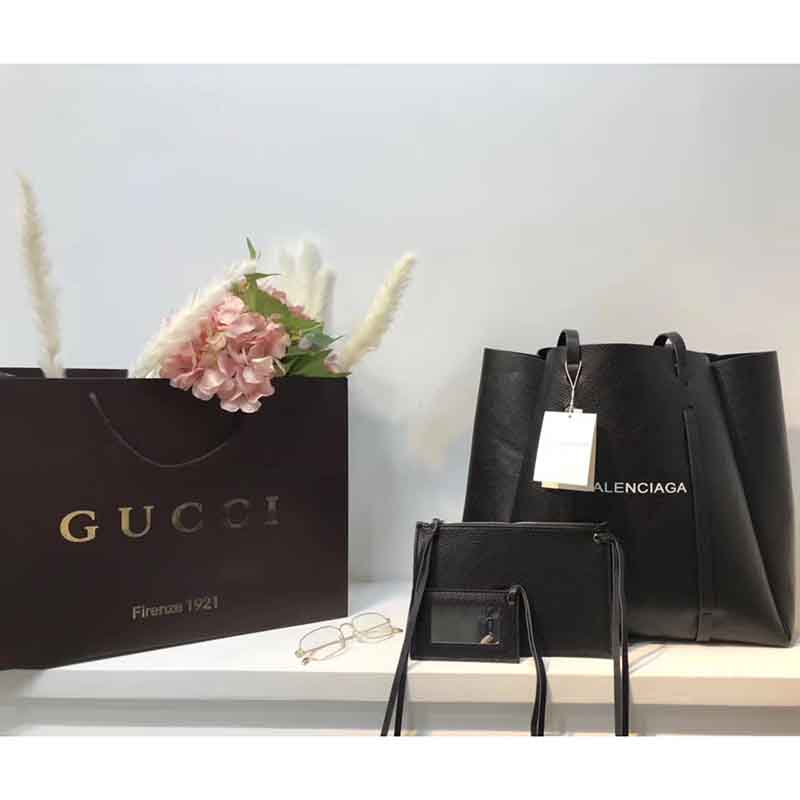Side angle showing structured silhouette of Balenciaga Everyday Tote M Calfskin with Handles-Black
