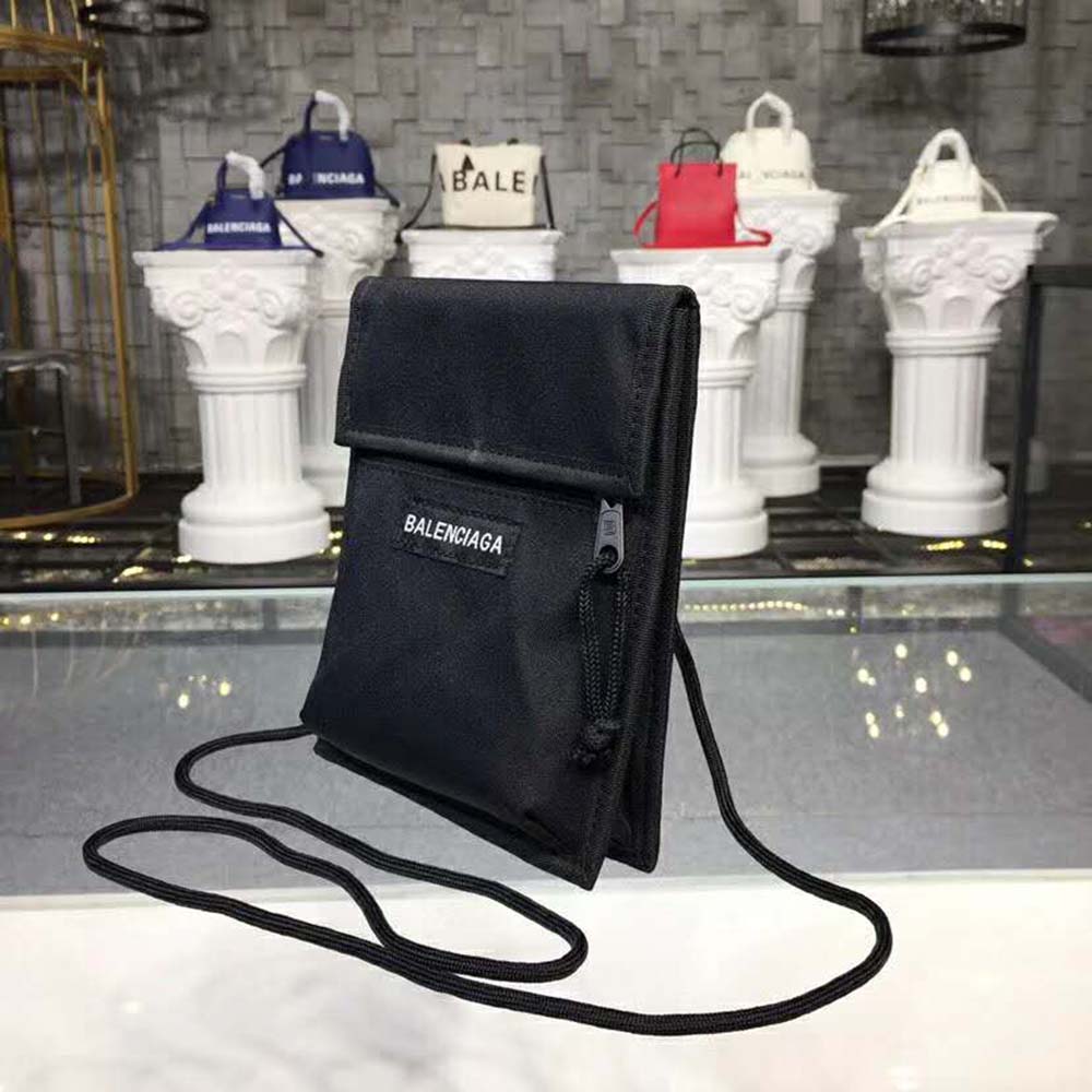 Side angle showing adjustable strap of Balenciaga Men Explorer Pouch Strap-Black
