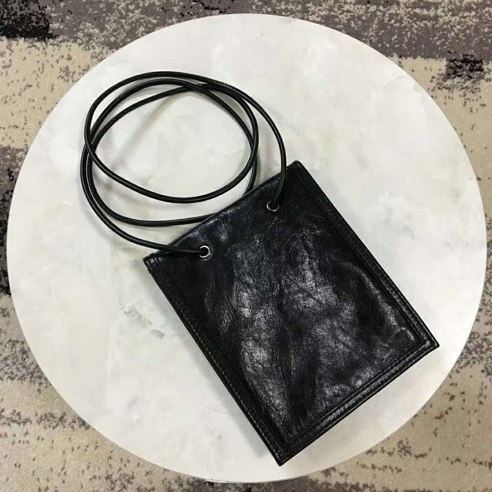 Side angle showing adjustable strap detail on Balenciaga Explorer Pouch Strap