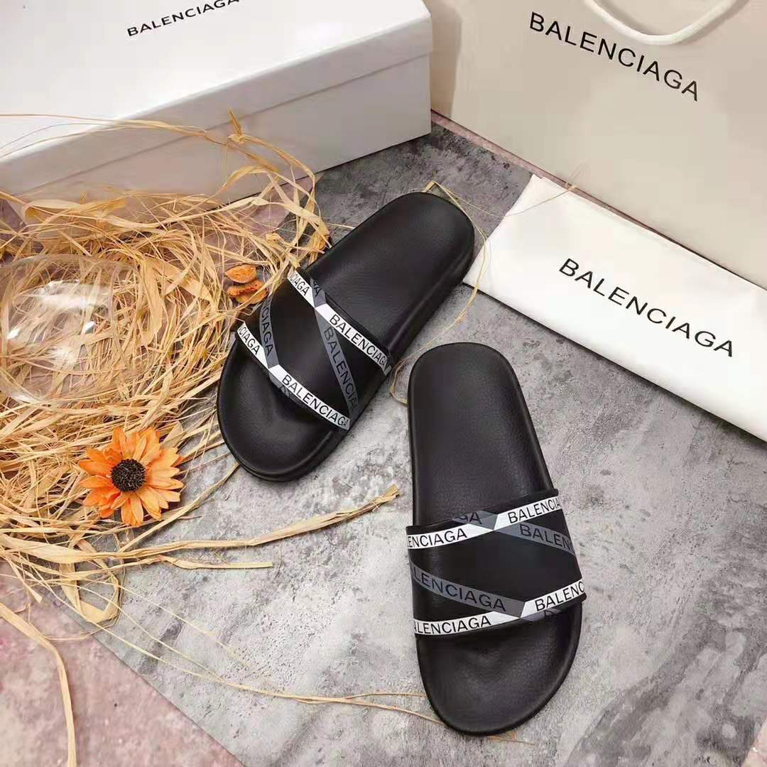Close-up on embossed monogram detail of Balenciaga Men Monogram Pool Slide Sandals
