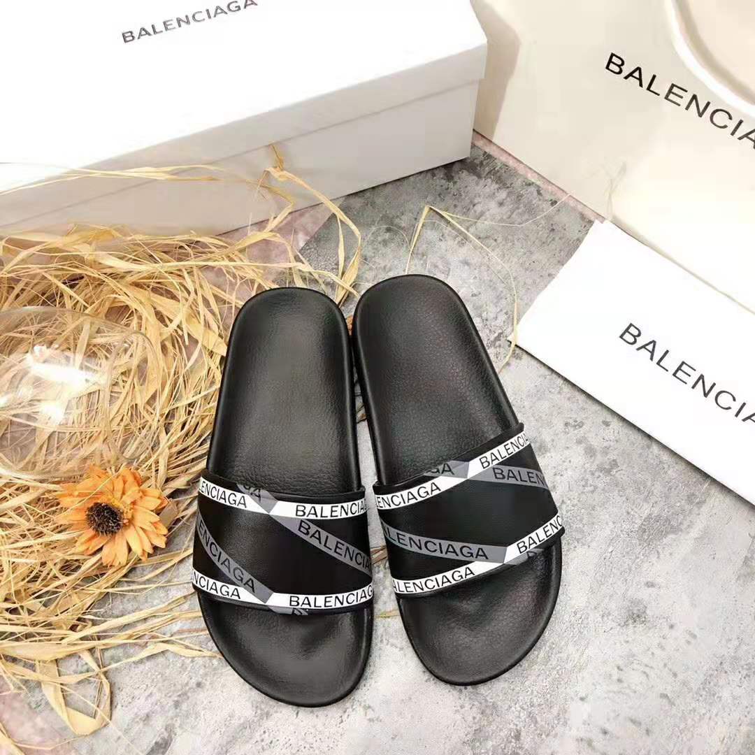 Side profile showing slip-on silhouette of Balenciaga Men Monogram Pool Slide Sandals