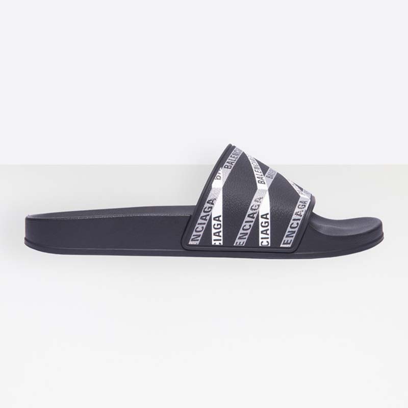 Front angle of Balenciaga Men Monogram Pool Slide Sandals in black rubber