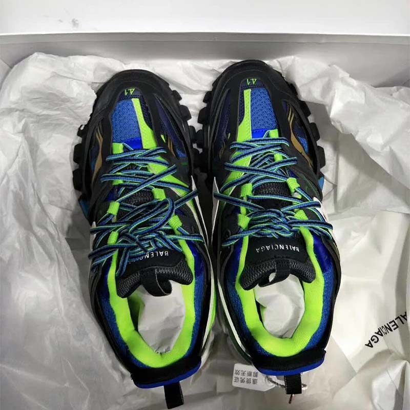 Close-up on black mesh and green nylon layers in Balenciaga Track Trainers