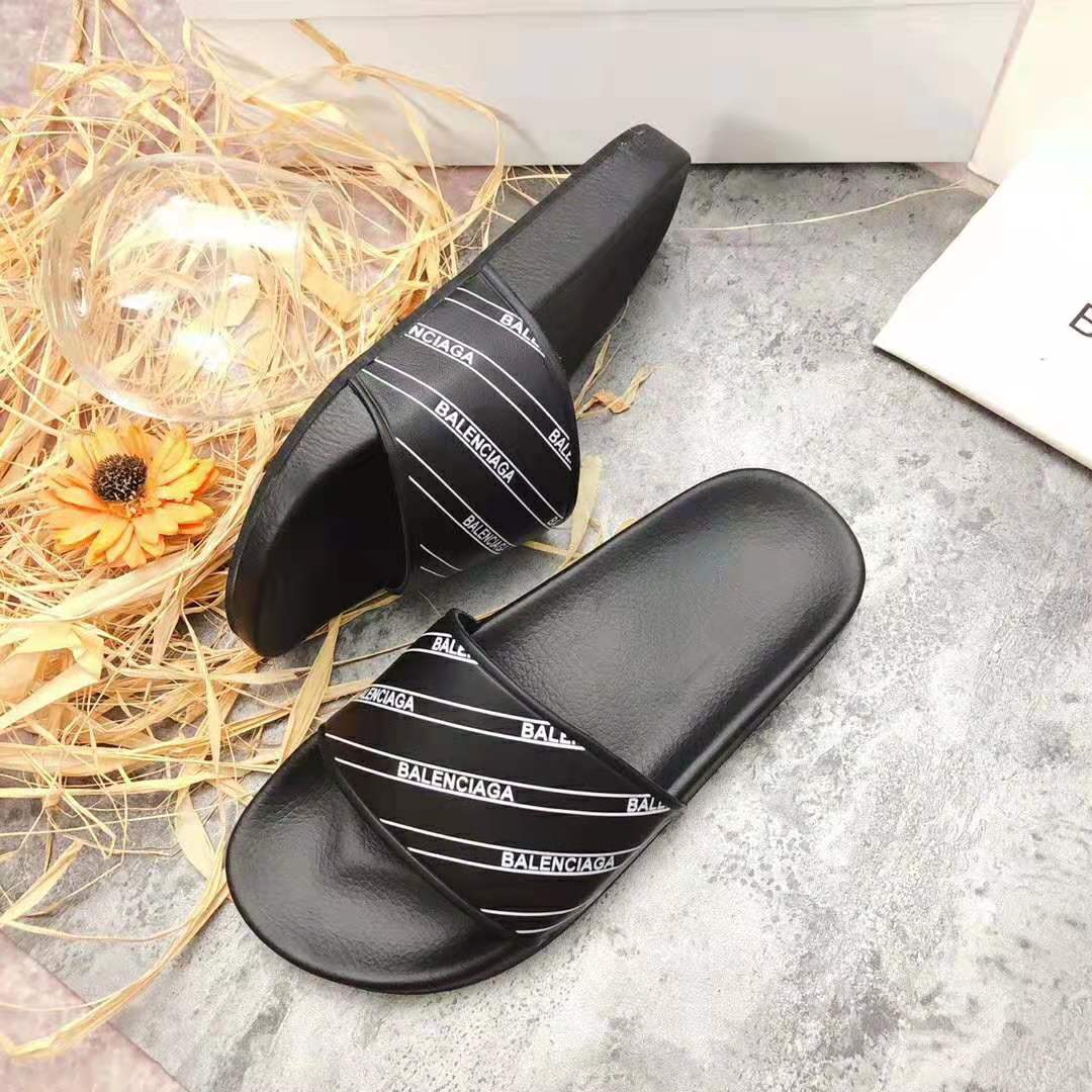 Close-up of printed rubber strap on Balenciaga Men Stripe Piscine Slide Sandal