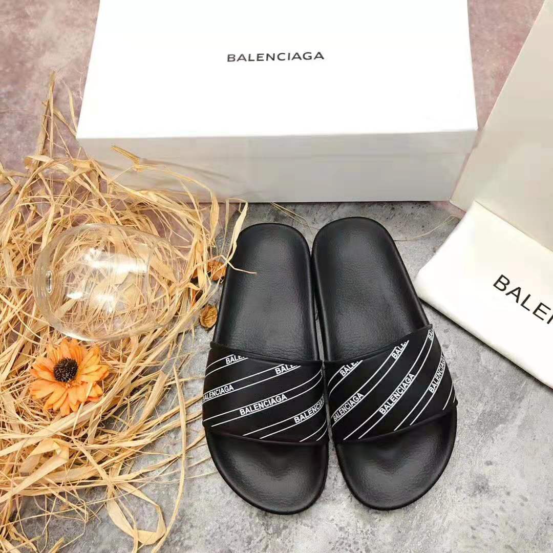 Side angle showing sole and silhouette of Balenciaga Men Stripe Piscine Slide Sandal