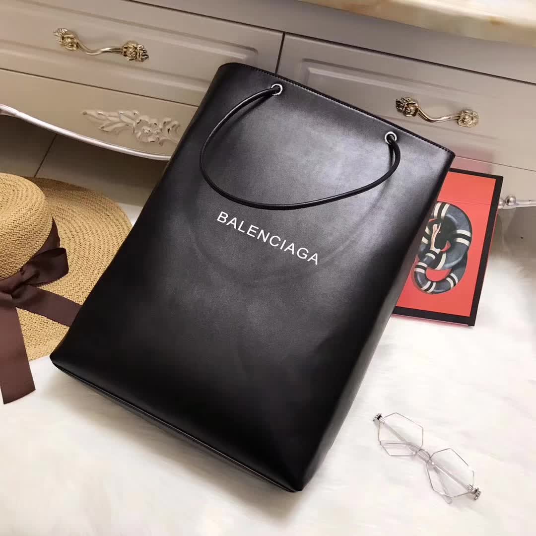 Side angle showing vertical silhouette of Balenciaga North-South Bag