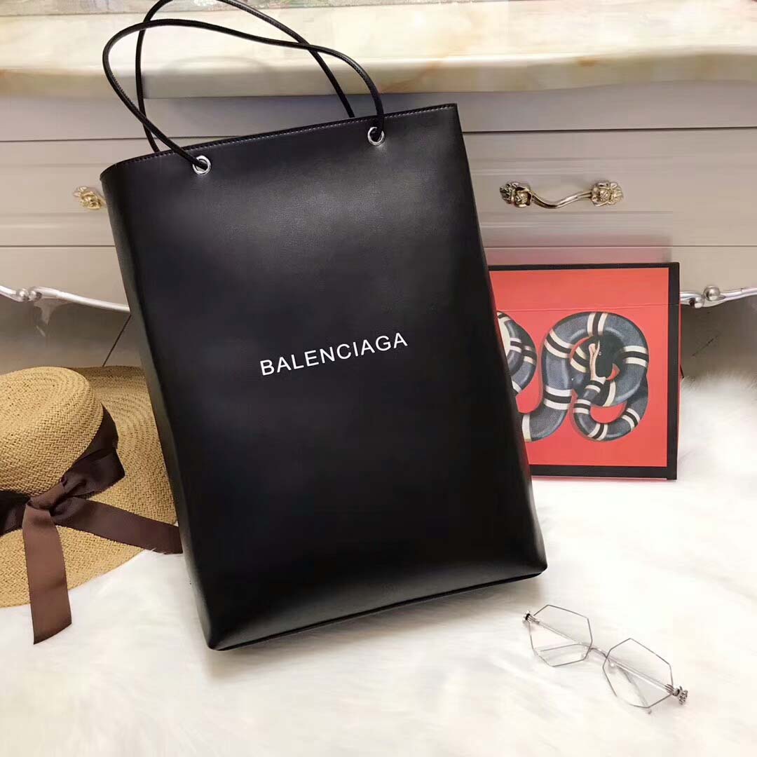 Close-up of smooth black calfskin and silver hardware details