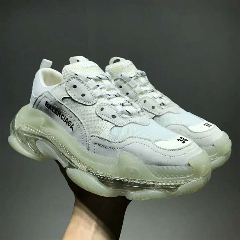Top angle showing white leather and mesh upper on Balenciaga Triple S