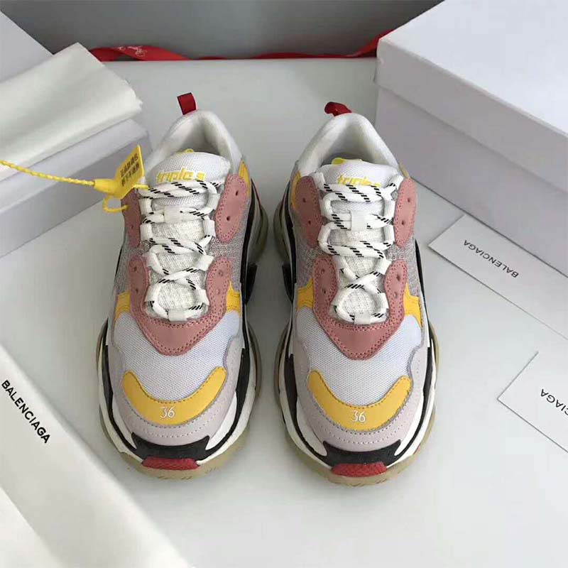 Top-down view of lace-up and branding on Balenciaga Triple S pink shoes