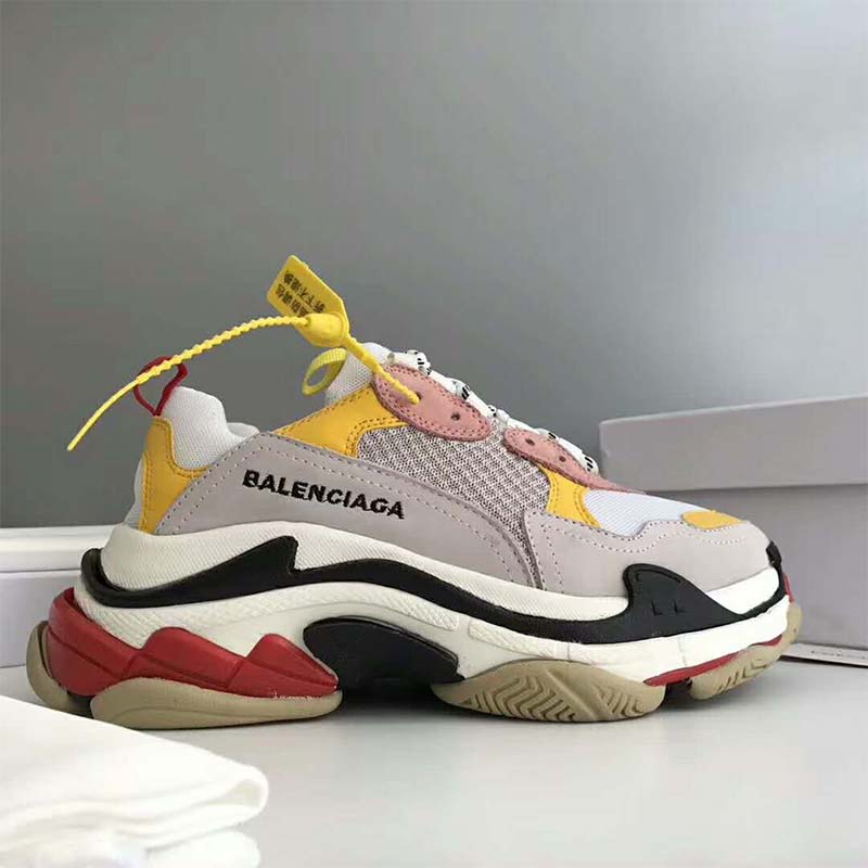Close-up of pink leather and suede on Balenciaga Triple S trainers