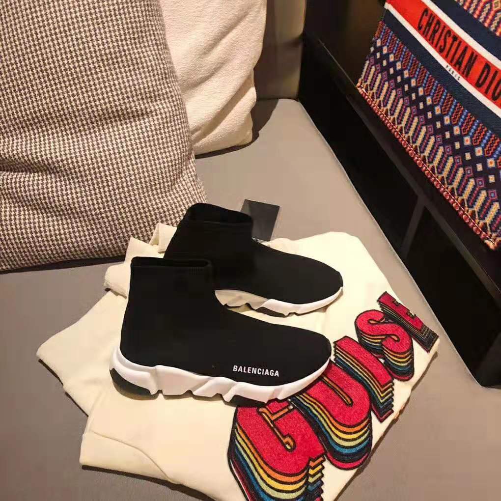 Close-up on Balenciaga logo embossed on Speed Trainer black sneaker