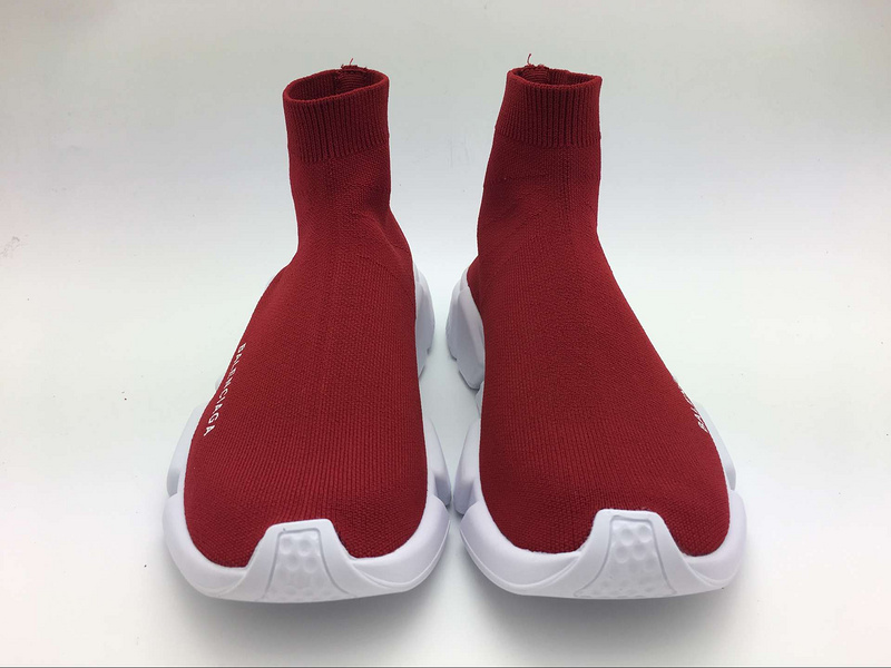 Close-up of embossed Balenciaga logo on red stretch mesh sneakers