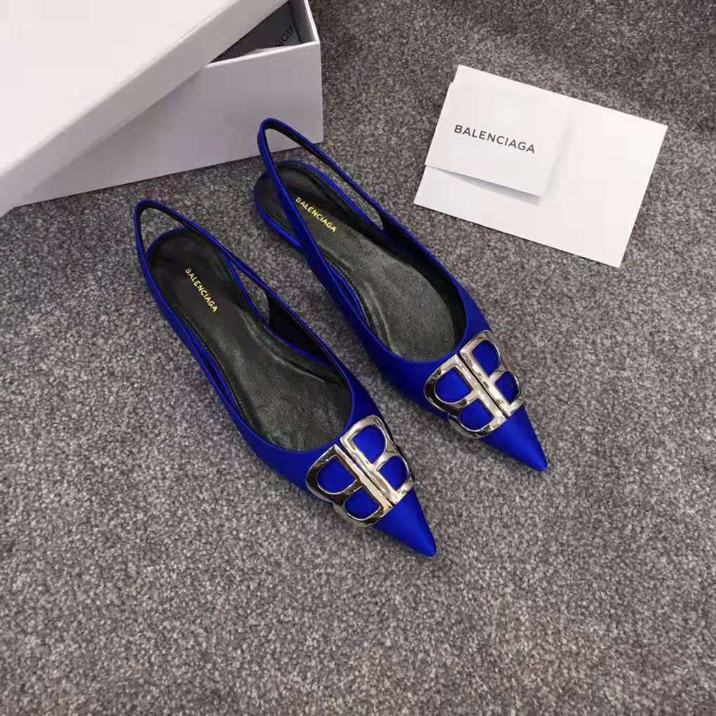 Close-up of polished BB hardware on electric blue slingback toe