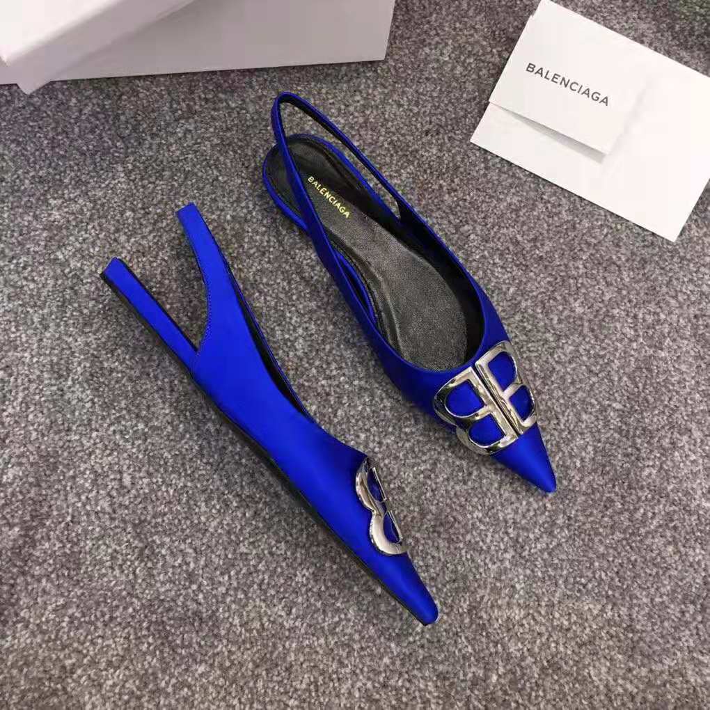 Rear view showing adjustable slingback strap on electric blue satin shoe