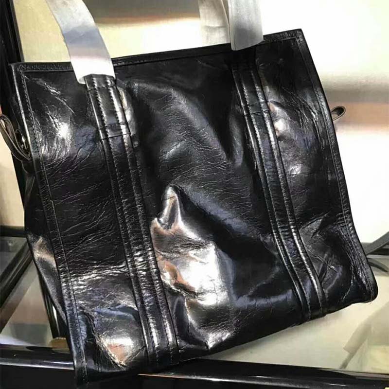 Side angle showing silhouette of Balenciaga Women Bazar Large Lambskin Shopping Bag-Black