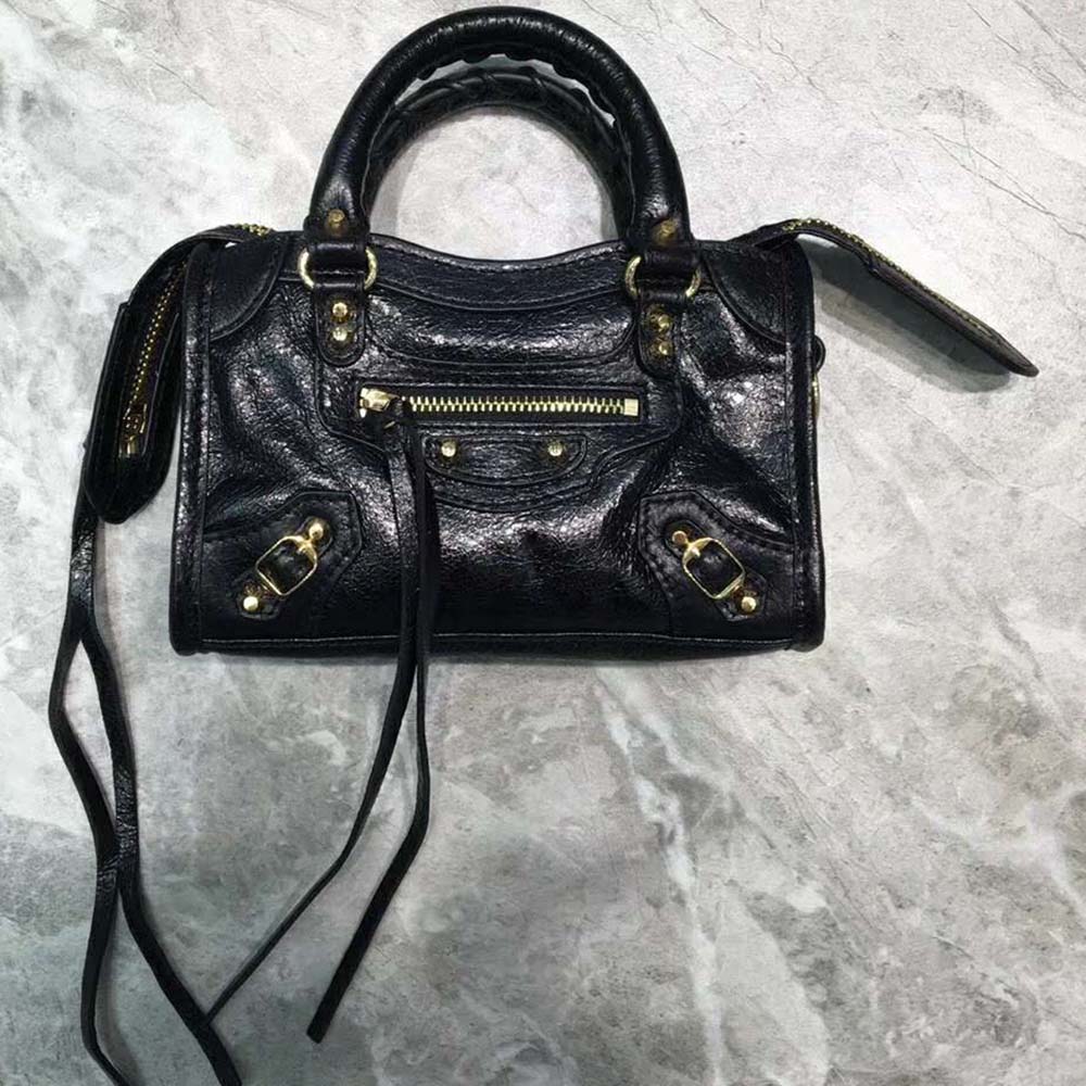 Close-up of gold hardware and tassel on Balenciaga Women Classic Gold Mini City-Black