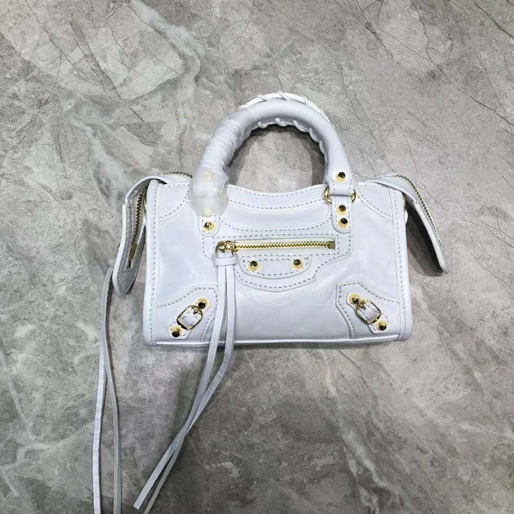 Close-up of silver closure and aqua leather texture on Balenciaga Mini City Bag