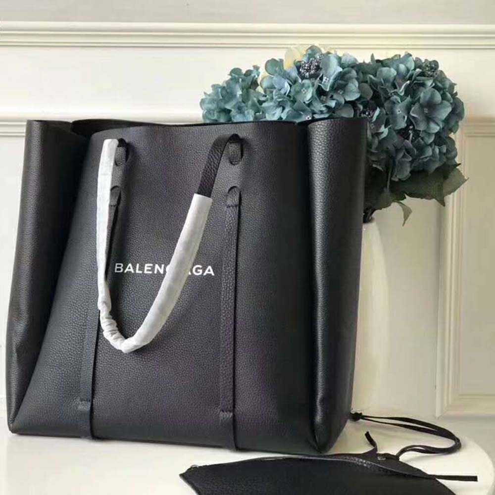 Close-up of black calfskin leather and silver hardware on tote