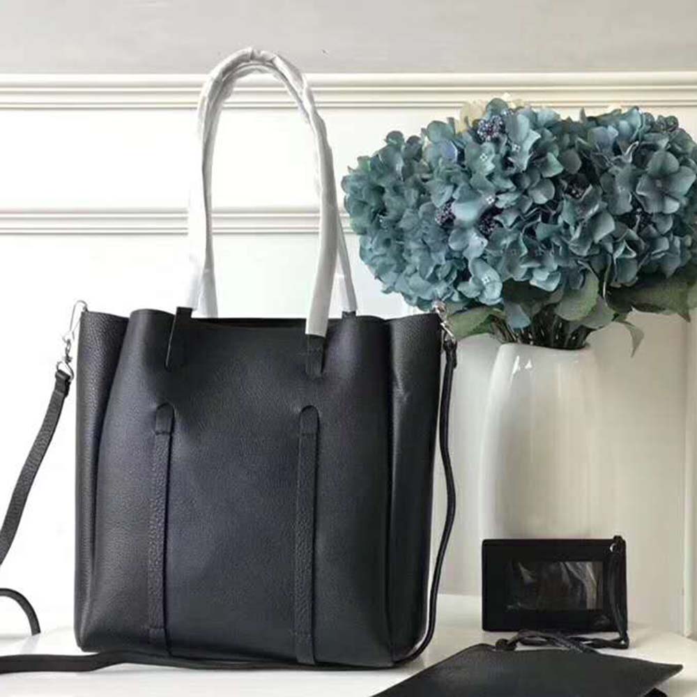 Side profile showing compact silhouette of Balenciaga Women Everyday Tote XS