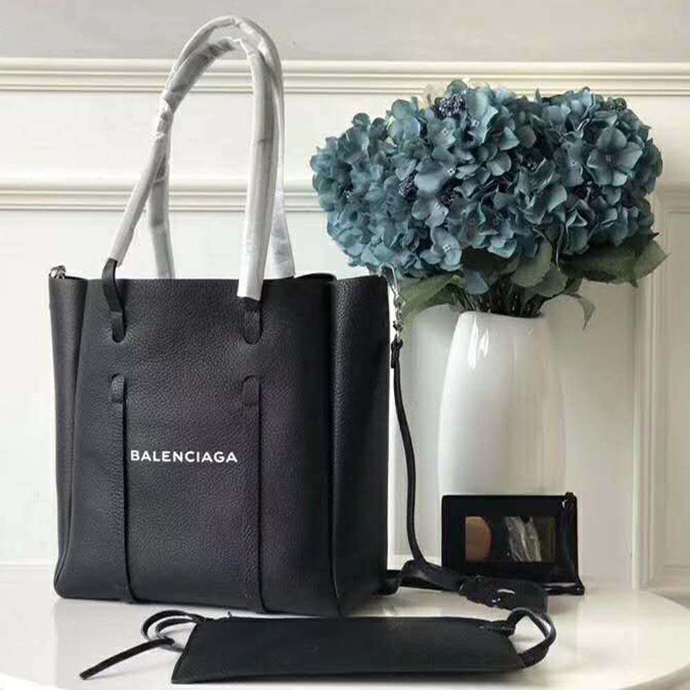 Close-up of silver hardware and thin handles on Balenciaga black tote