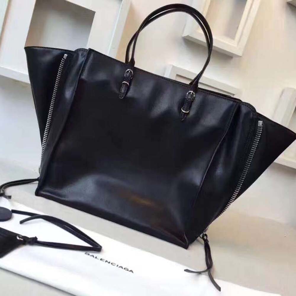 Side angle showing slim silhouette of Balenciaga Women Papier A6 crossbody bag