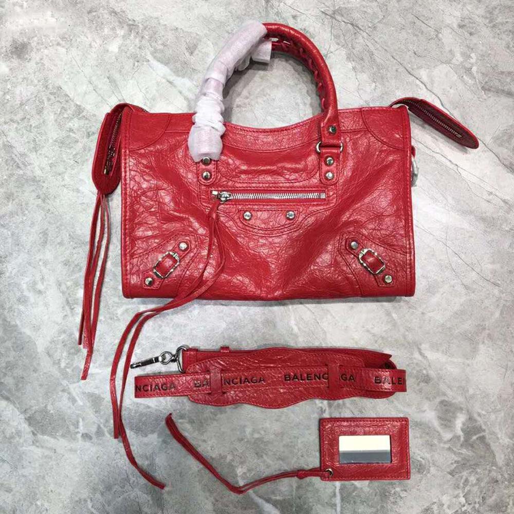 Side profile showing adjustable cross body strap on Balenciaga Women Papier B4 tote