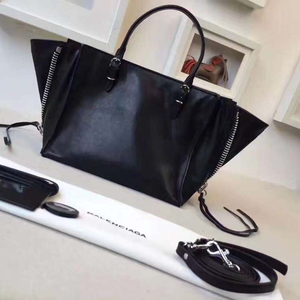 Side angle showing slim silhouette of Balenciaga Women Papier Mini A4 Calfskin shoulder bag