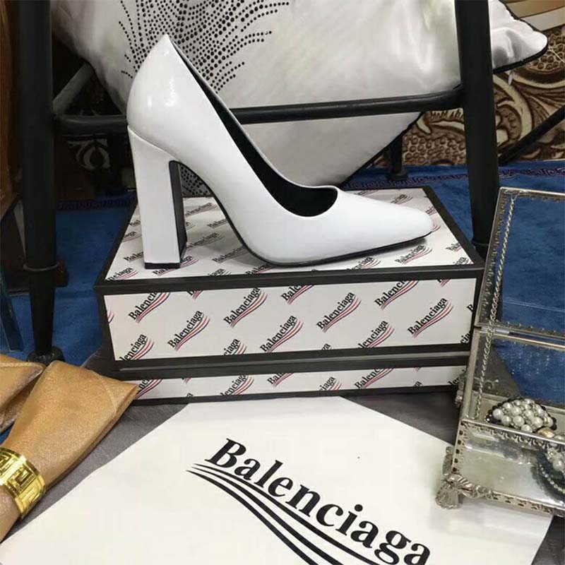 Close-up on the glazed calfskin and embossed logo on Balenciaga white pumps