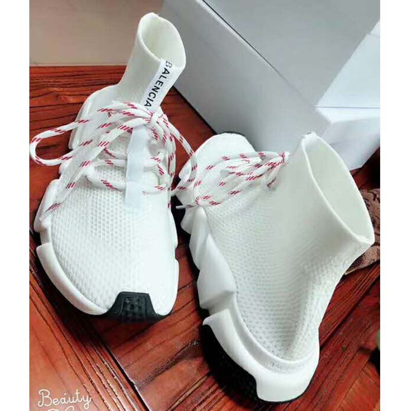 Angled shot of Balenciaga Women Shoes Speed Trainers 10mm Heel-White signature sole detail