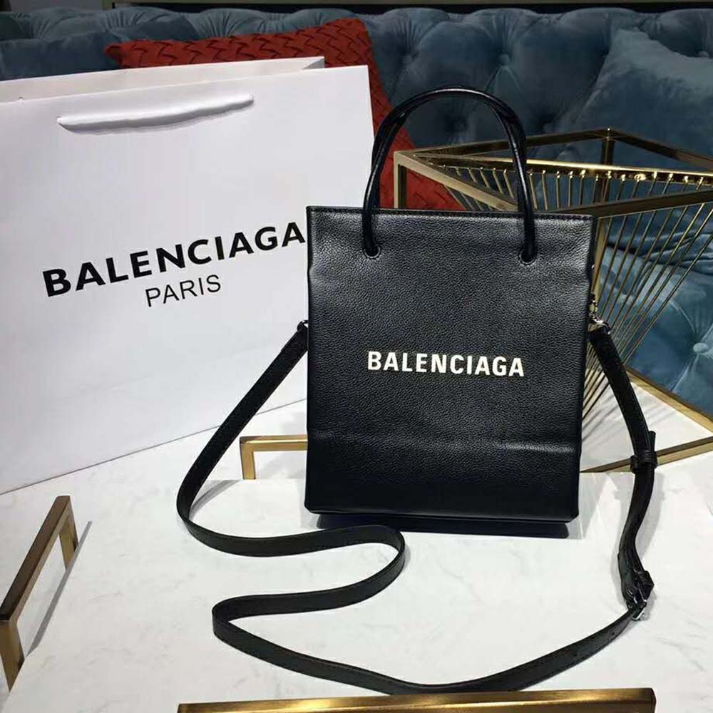 Side angle showing compact silhouette of Balenciaga Women Shooping Tote XXS Small Natural Grain Calfskin-Black