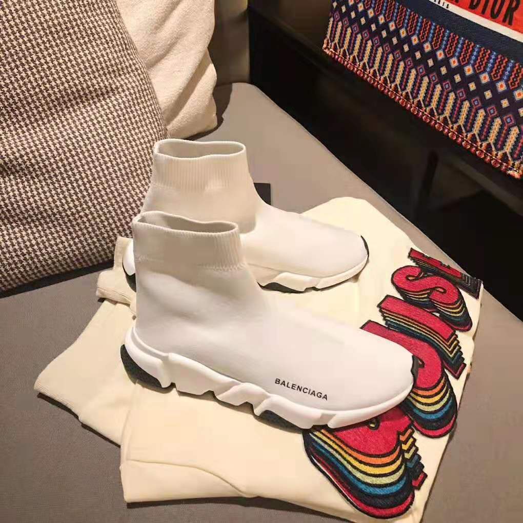 Close-up of knit upper and Balenciaga logo on white Speed Trainers