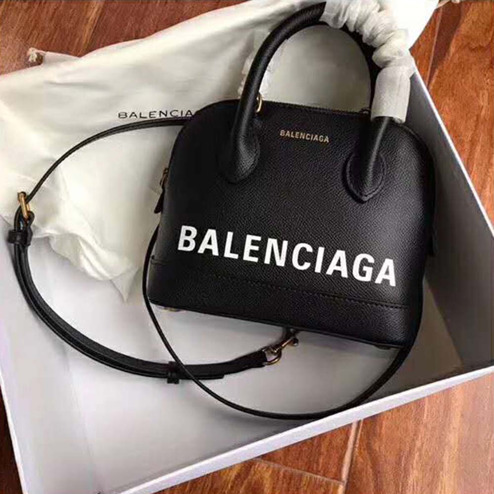 Close-up of graffiti print and silver hardware on Balenciaga Ville handbag
