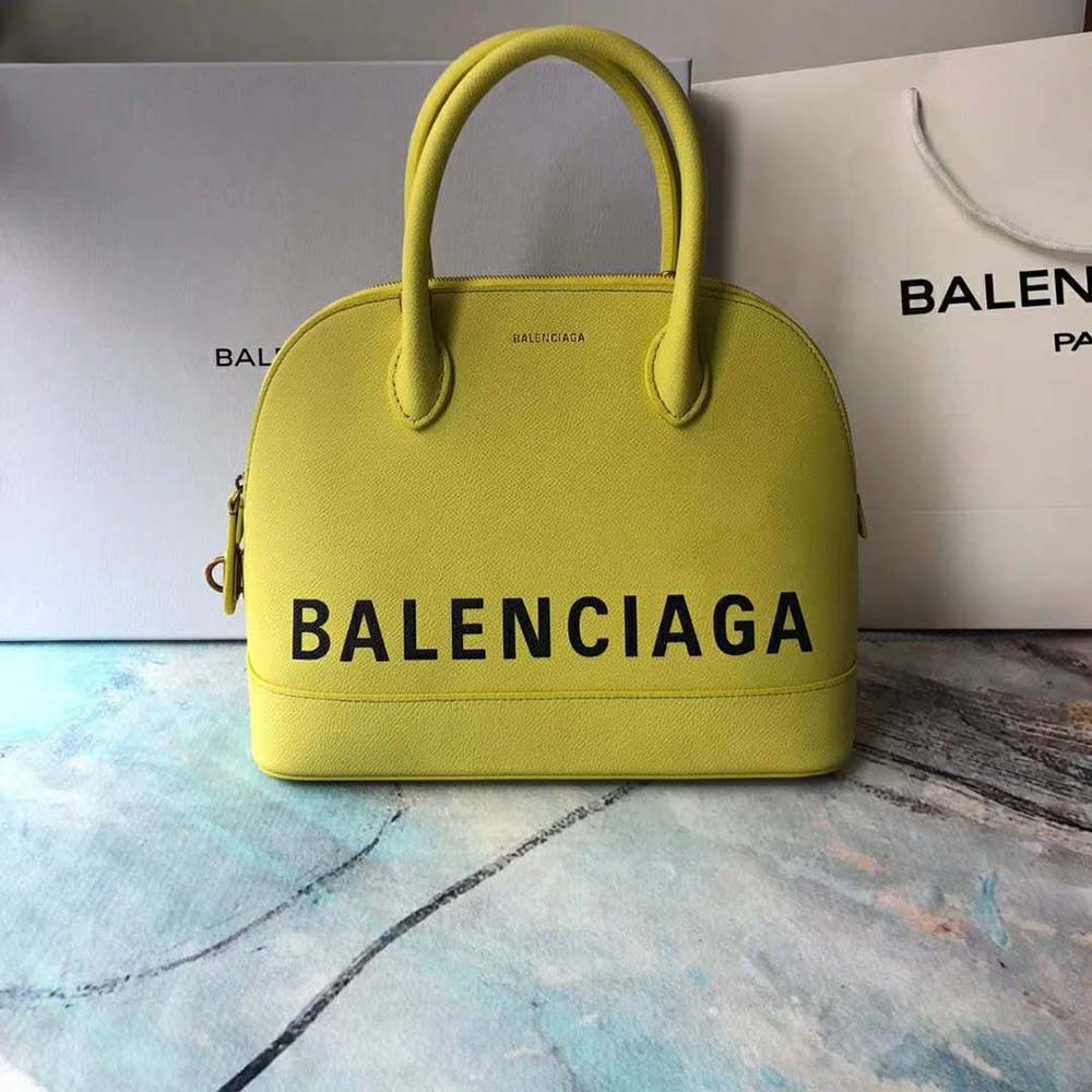 Close-up of yellow calfskin and graffiti print details on Balenciaga handbag