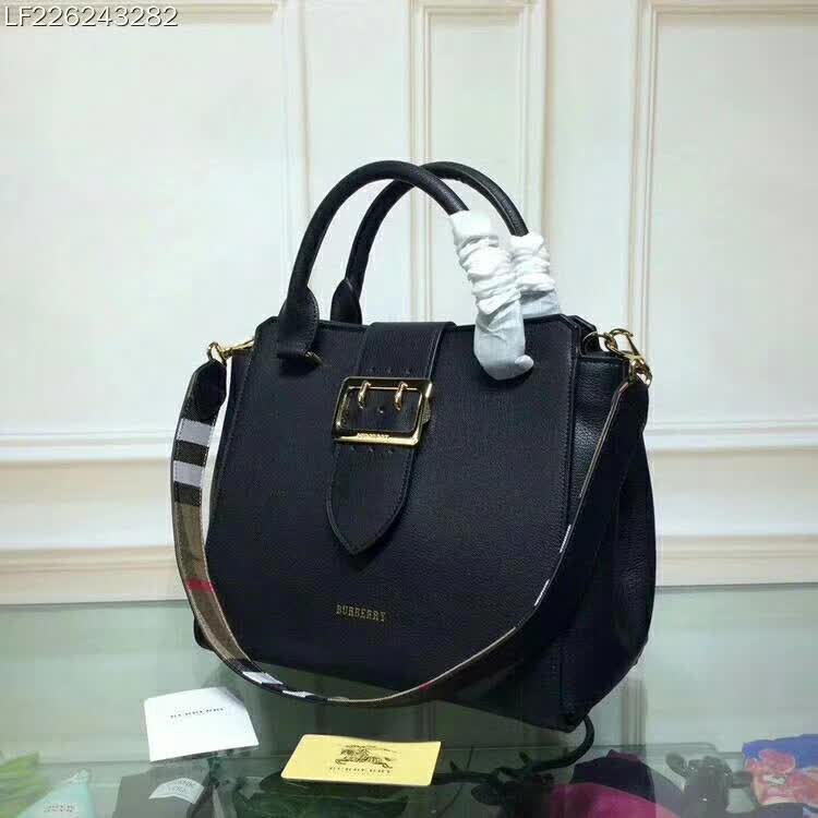 Close-up of buckle detail on Burberry Medium Buckle Tote in Grainy Leather-Black