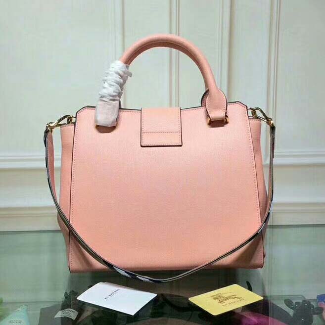 Side angle showing structured silhouette of Burberry Medium Buckle Tote